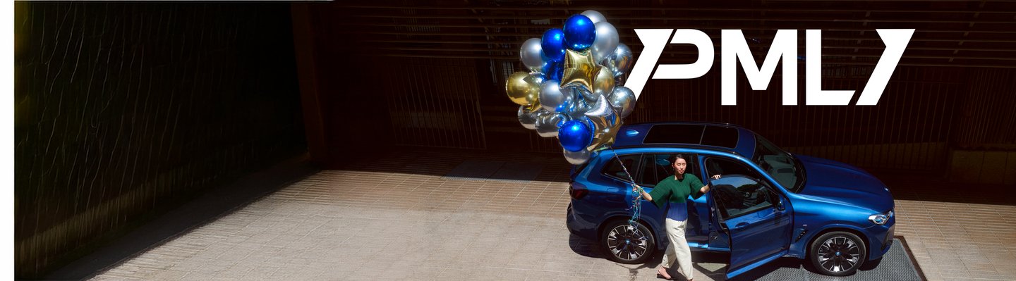 A PML ONE member with balloons beside her blue BMW X3.